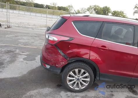 2017 Ford Escape Titanium z USA, uszkodzony, nr VIN 1FMCU0JD7HUA49313